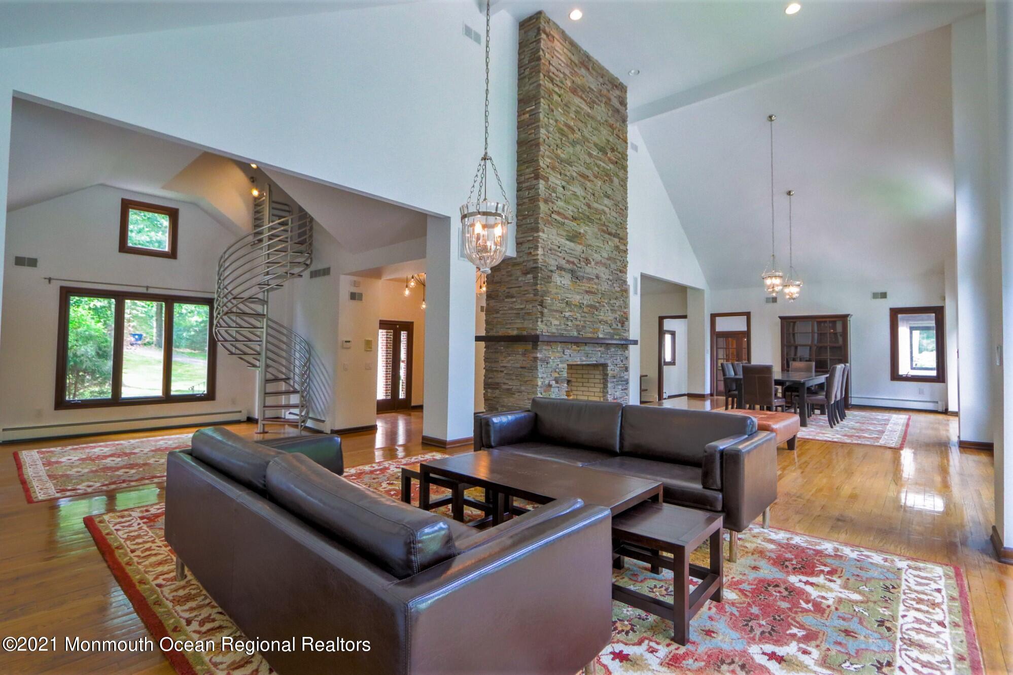 7 Perrine Circle Millstone Township, NJ 08535 - Photo 5 of 27 a living room with furniture windows and a fireplace