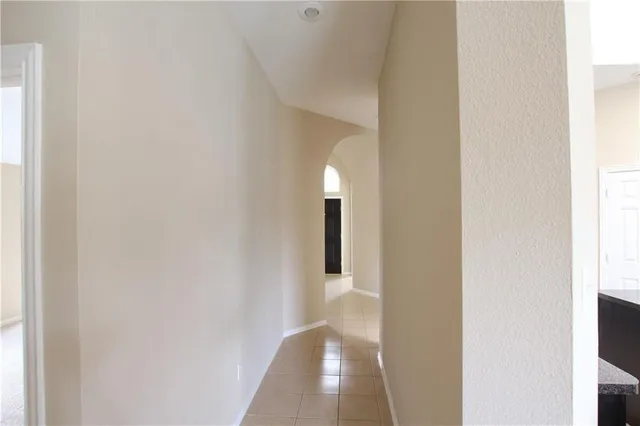 a kitchen with granite countertop stainless steel appliances a sink stove top oven and microwave