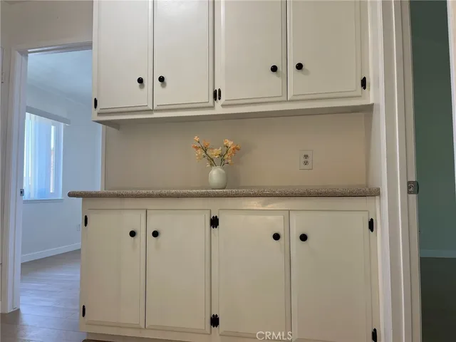 a view of cabinets and wooden floor