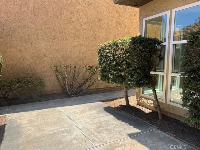 a view of balcony and yard