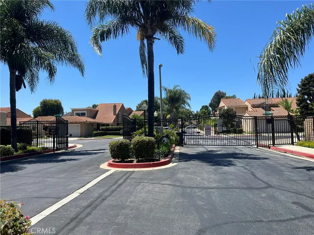 a city street with palm trees
