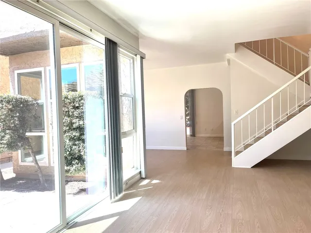 a view of interior and hall with wooden floor