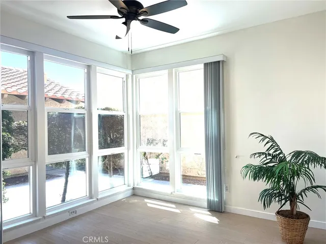 a view of a room with window and wooden floor