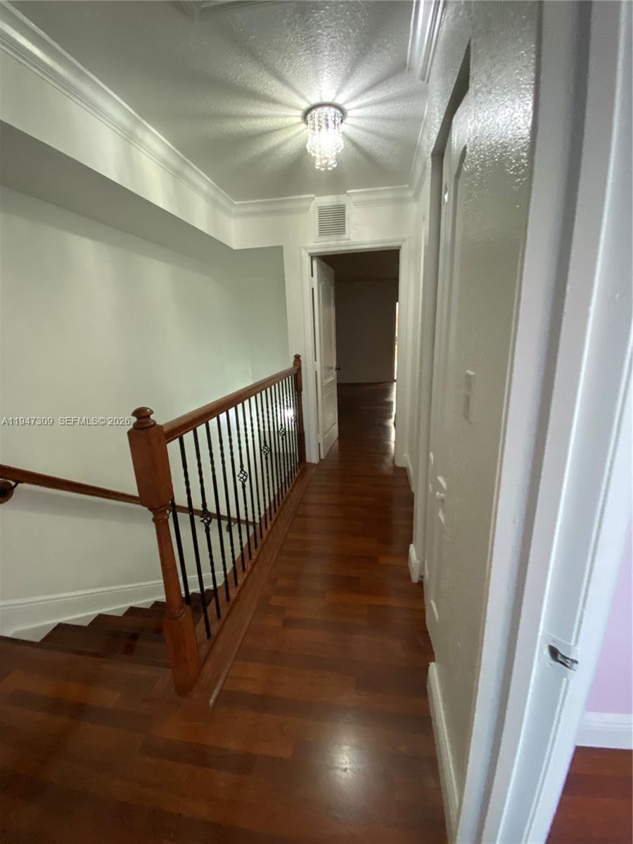3503 West 76th Street, Unit 4 Hialeah, FL 33018 - Photo 17 of 31 a view of a hallway with wooden floor and staircase