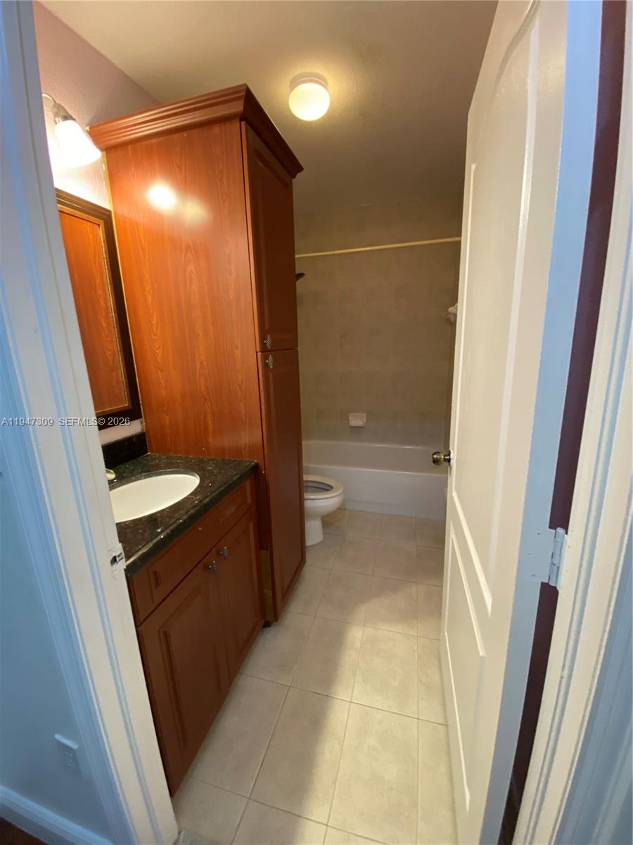 3503 West 76th Street, Unit 4 Hialeah, FL 33018 - Photo 21 of 31 a bathroom with a shower and a toilet