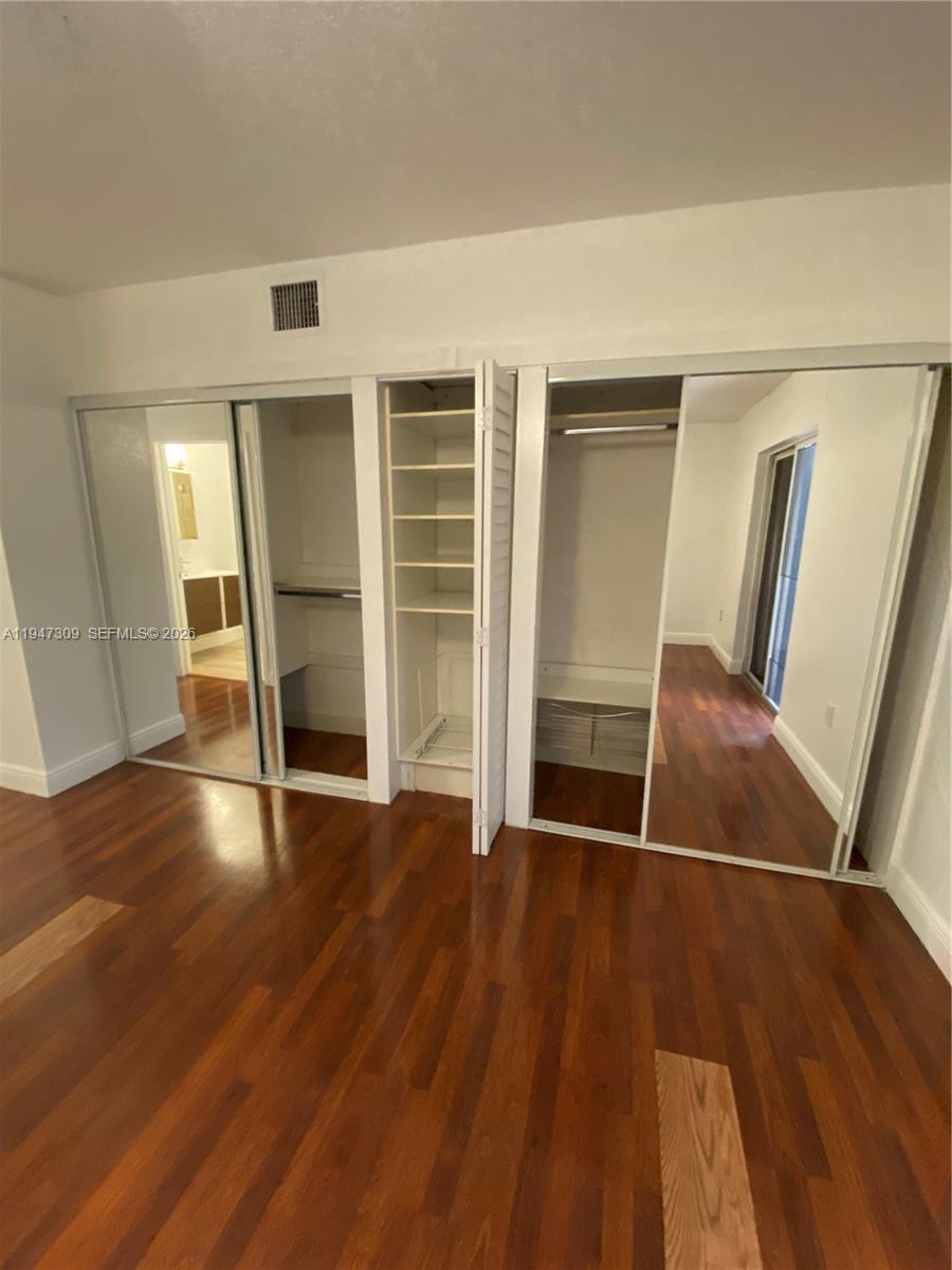 3503 West 76th Street, Unit 4 Hialeah, FL 33018 - Photo 25 of 31 an empty room with wooden floor and entrance