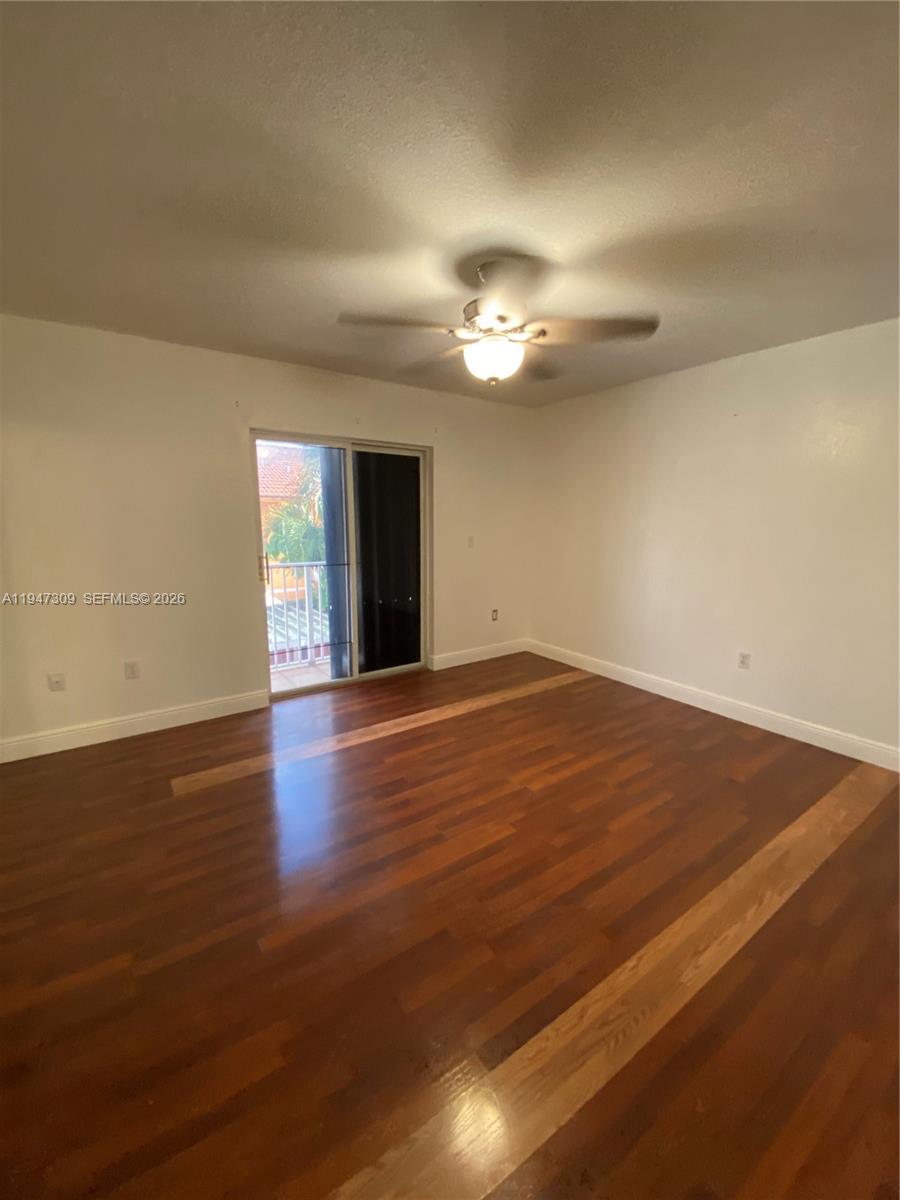 3503 West 76th Street, Unit 4 Hialeah, FL 33018 - Photo 26 of 31 a view of empty room with wooden floor and fan