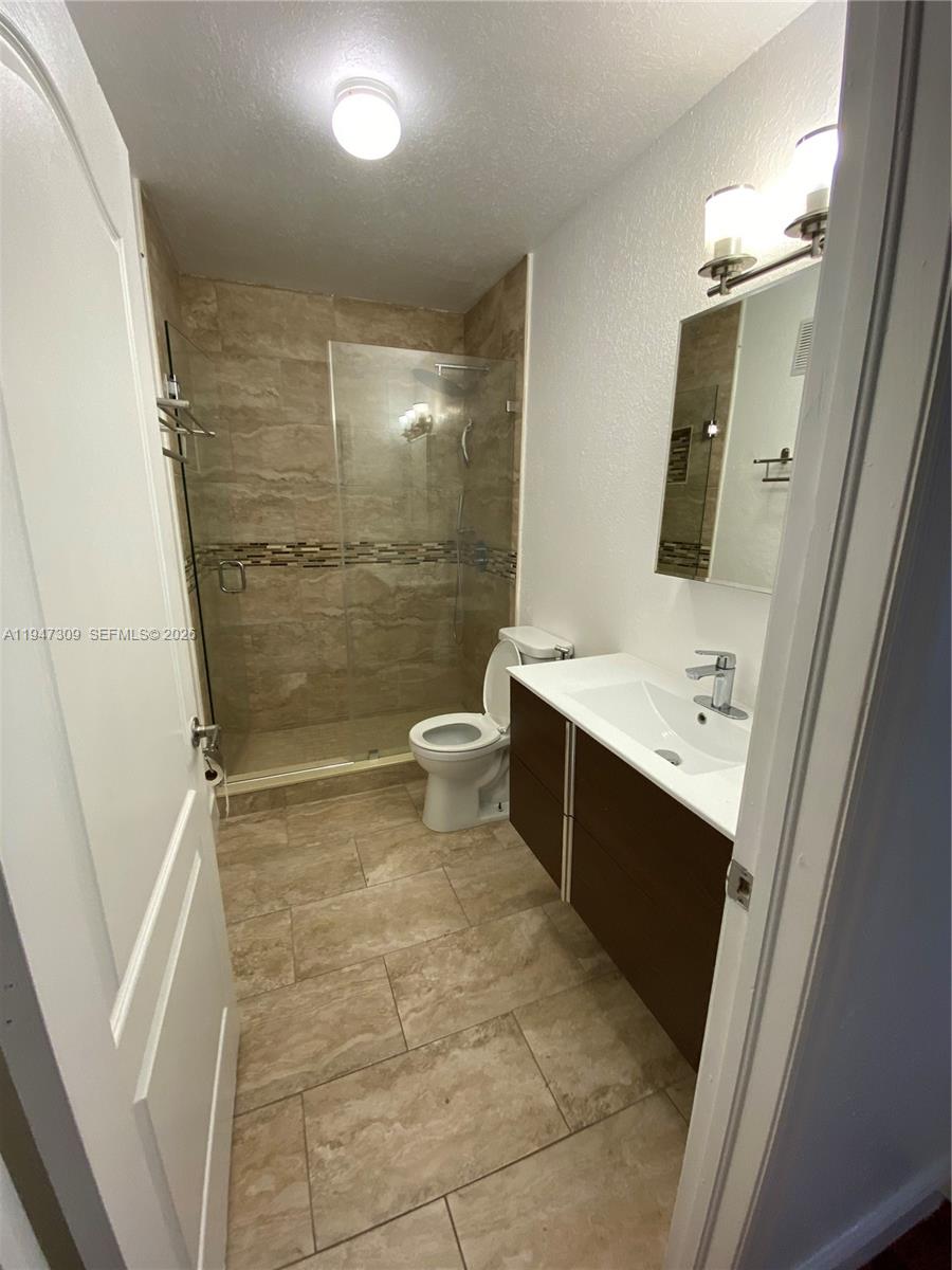 3503 West 76th Street, Unit 4 Hialeah, FL 33018 - Photo 27 of 31 a bathroom with a sink a toilet and shower