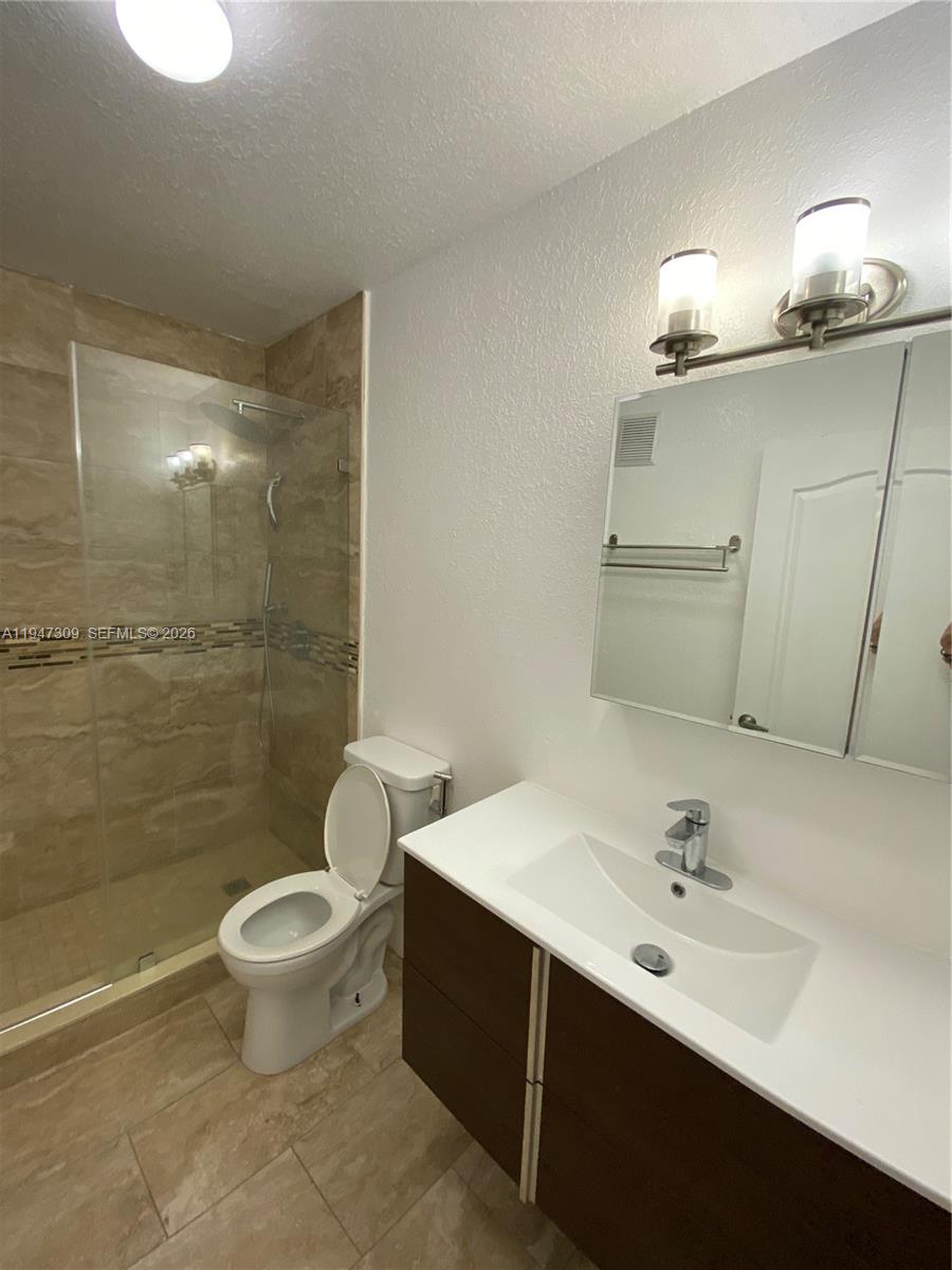 3503 West 76th Street, Unit 4 Hialeah, FL 33018 - Photo 28 of 31 a bathroom with a sink toilet and shower