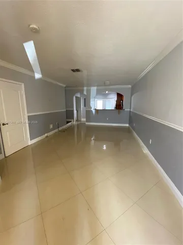 a view of a storage & utility room with a sink