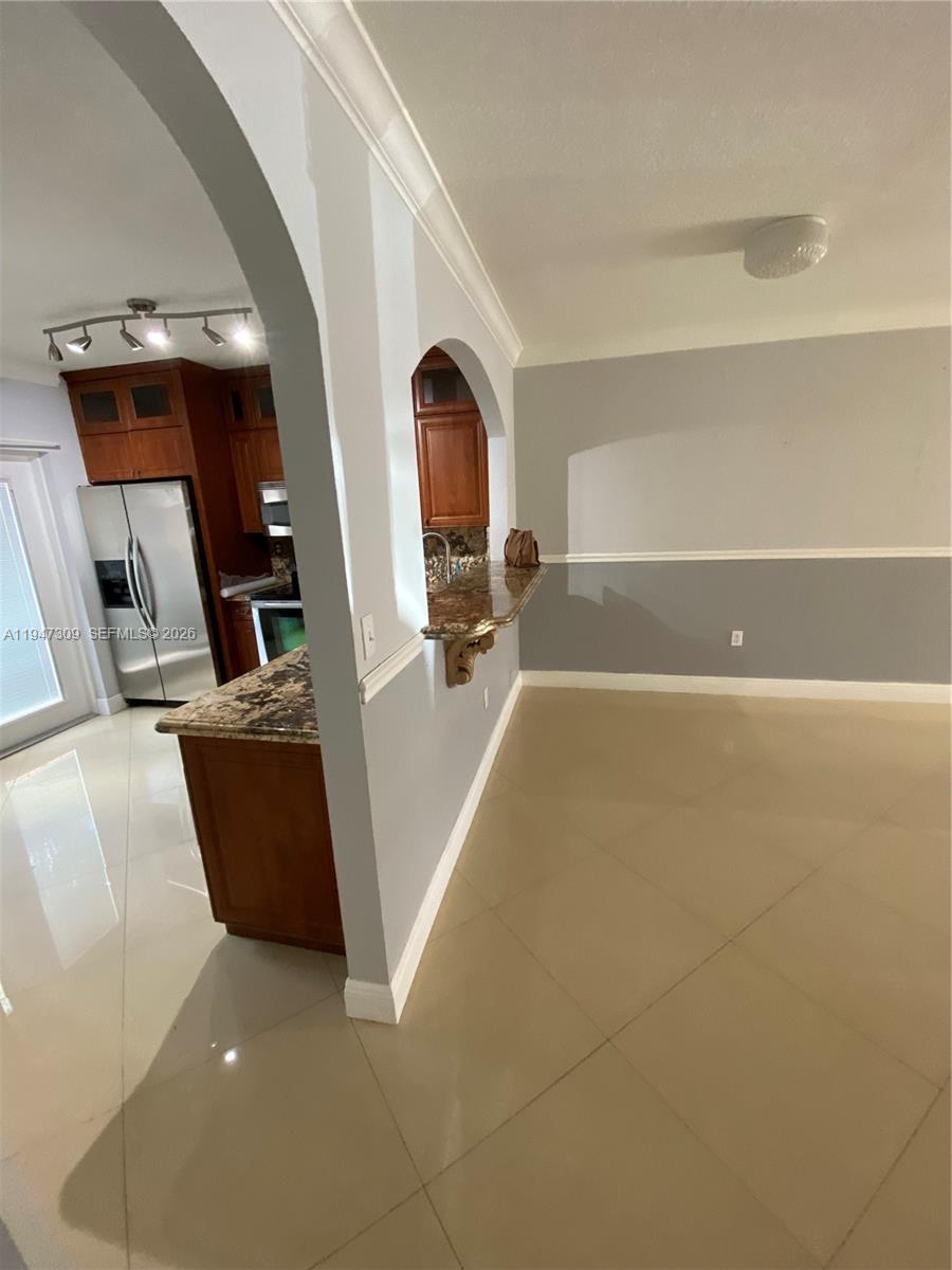 3503 West 76th Street, Unit 4 Hialeah, FL 33018 - Photo 6 of 31 a view of a living room with furniture and a flat screen tv