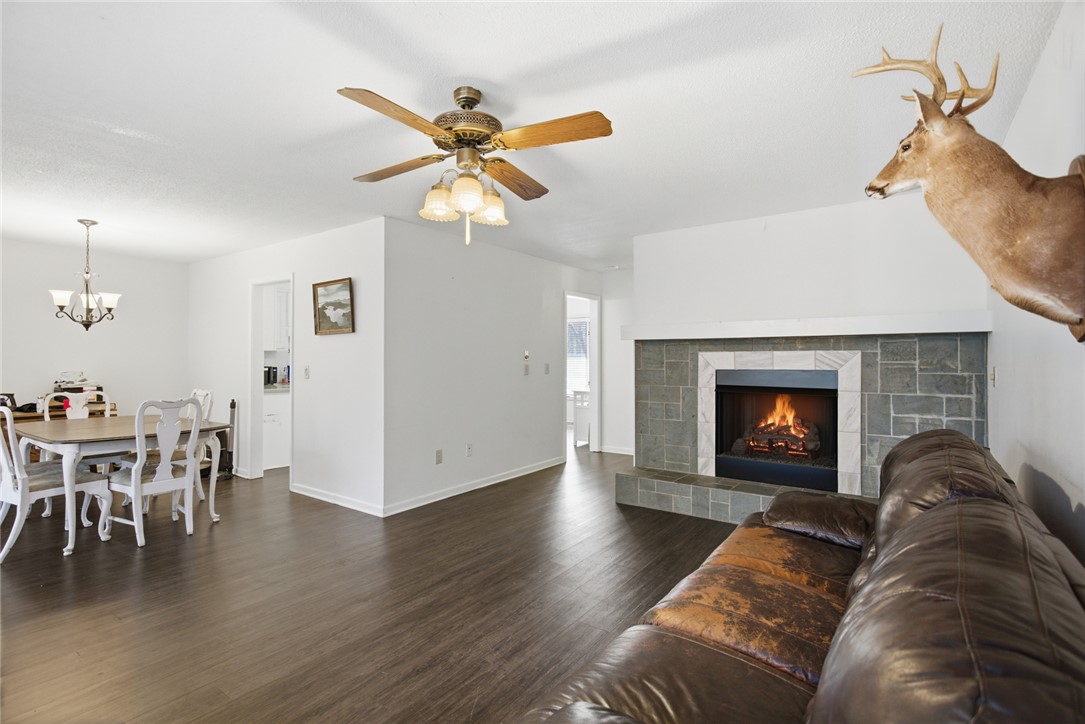 308 Wildwood Road Walhalla, SC 29691 - Photo 4 of 23 This inviting space features an elegant fireplace and rich hardwood flooring, perfect for cozy gatherings.