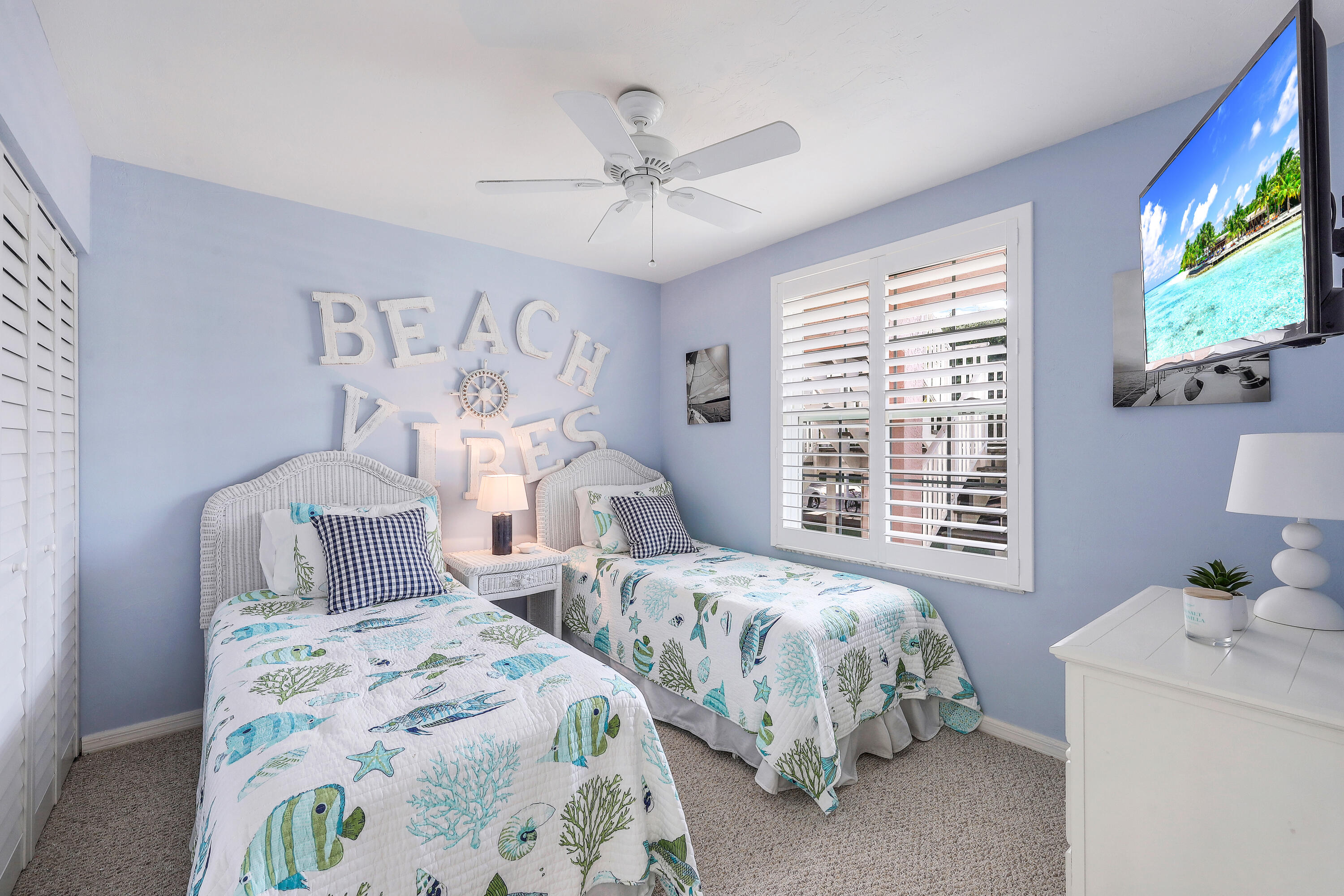 960 Huron Street, Unit 106 Marco Island, FL 34145 - Photo 16 of 39 a bedroom with two beds and a large window