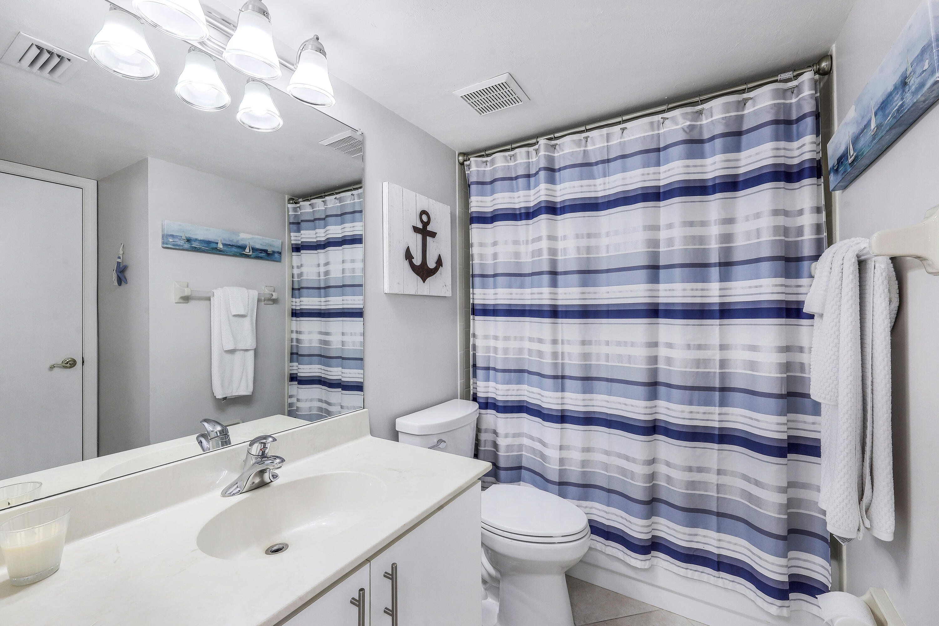 960 Huron Street, Unit 106 Marco Island, FL 34145 - Photo 17 of 39 a bathroom with a sink toilet and shower