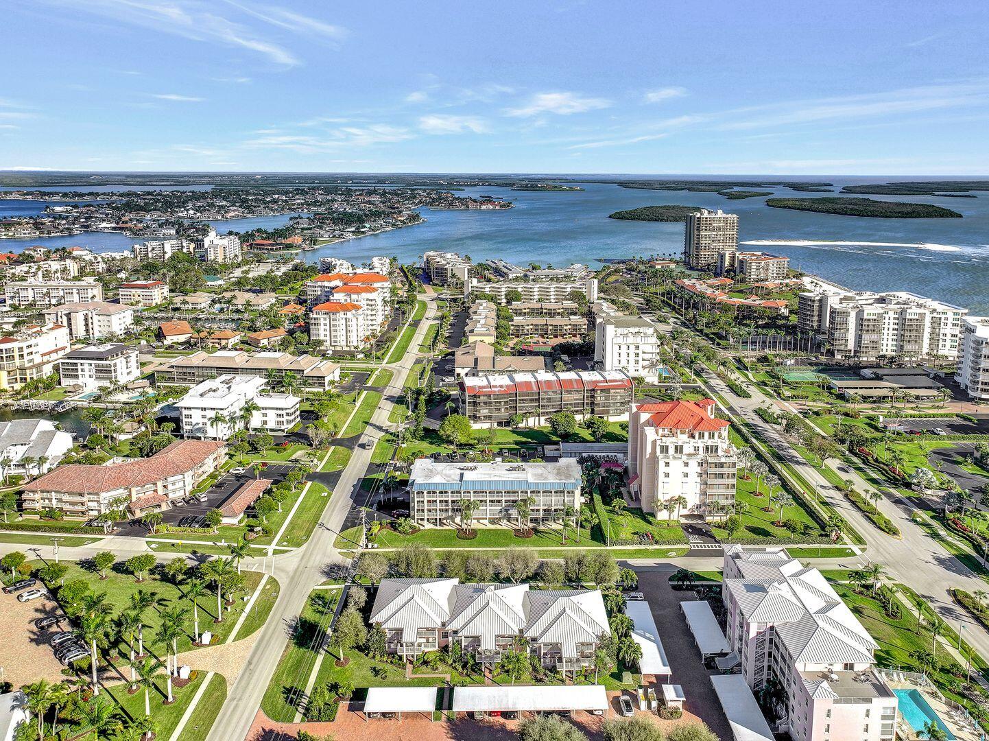 960 Huron Street, Unit 106 Marco Island, FL 34145 - Photo 2 of 39 a view of parking and city