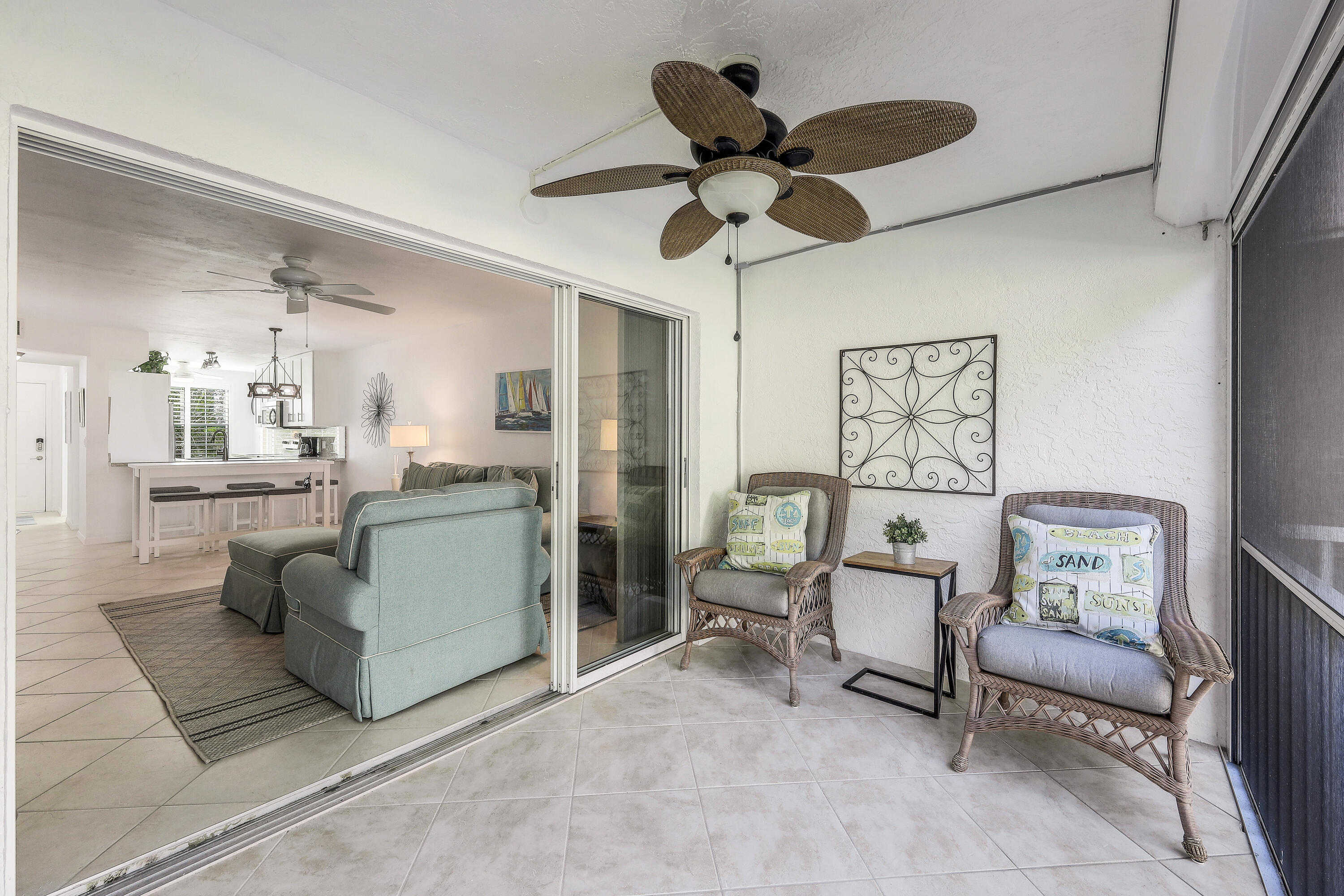 960 Huron Street, Unit 106 Marco Island, FL 34145 - Photo 21 of 39 a living room with furniture and a chandelier
