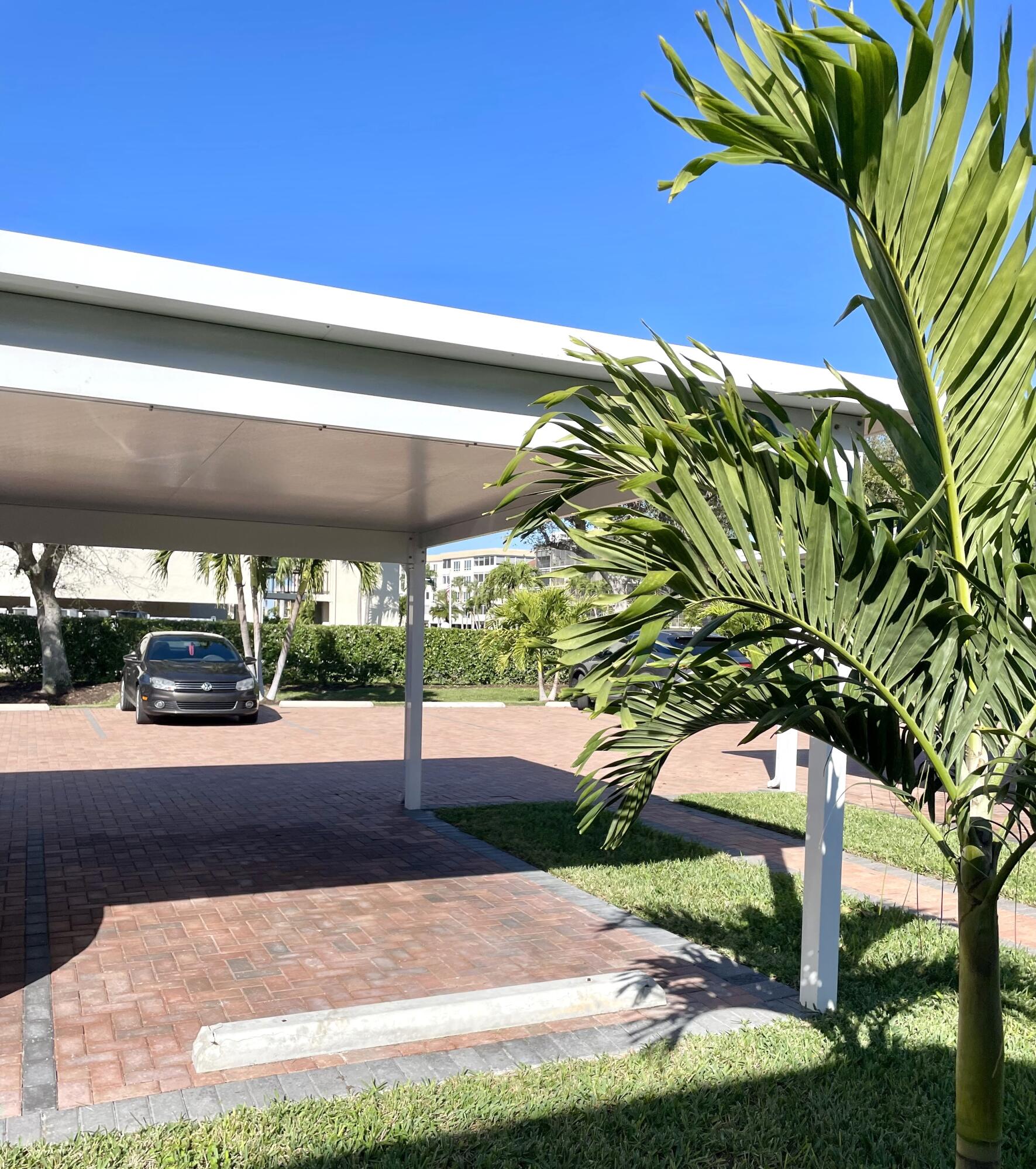 960 Huron Street, Unit 106 Marco Island, FL 34145 - Photo 24 of 39 a view of a street with a tree