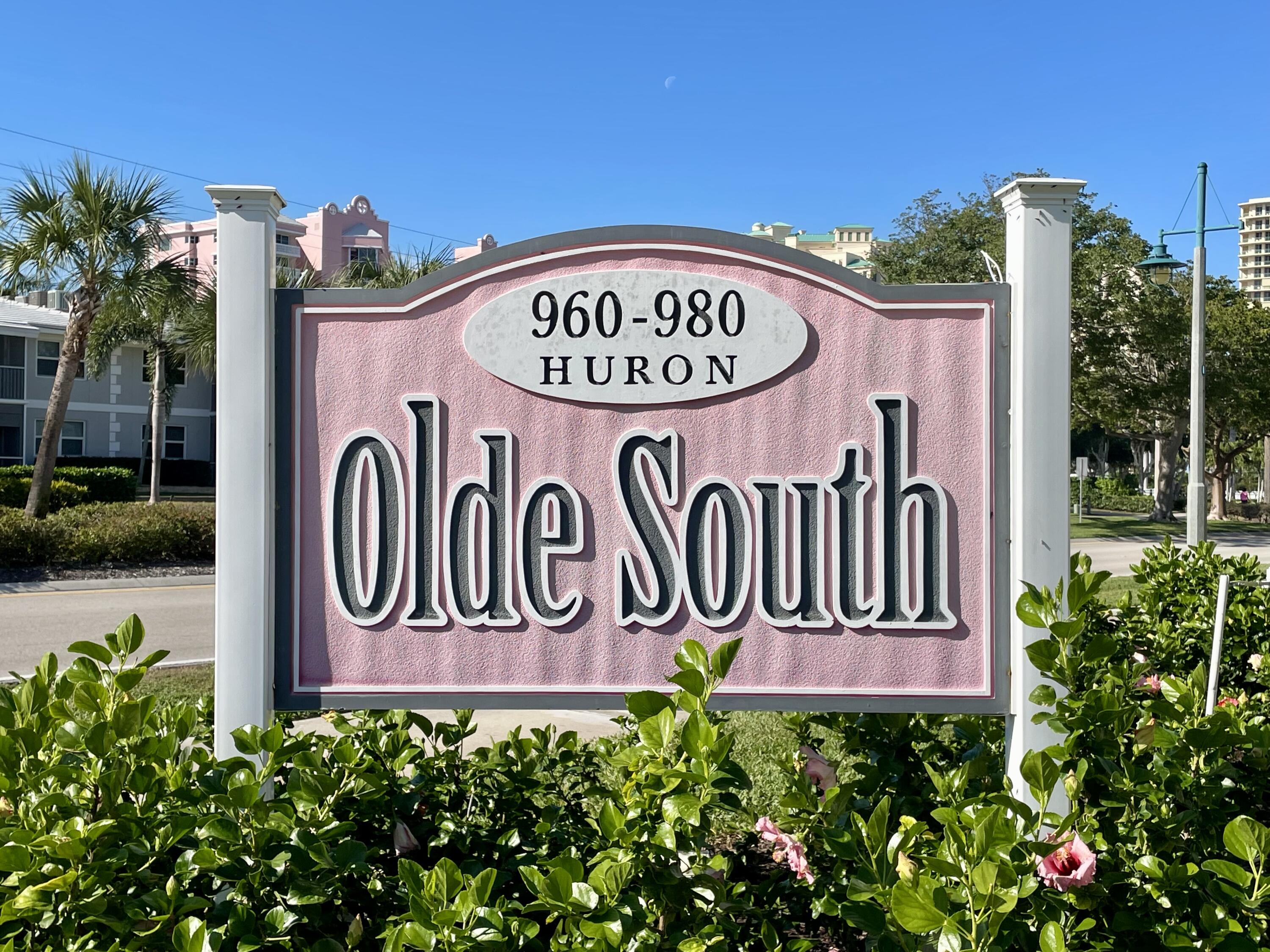 960 Huron Street, Unit 106 Marco Island, FL 34145 - Photo 26 of 39 a sign on the side of a building