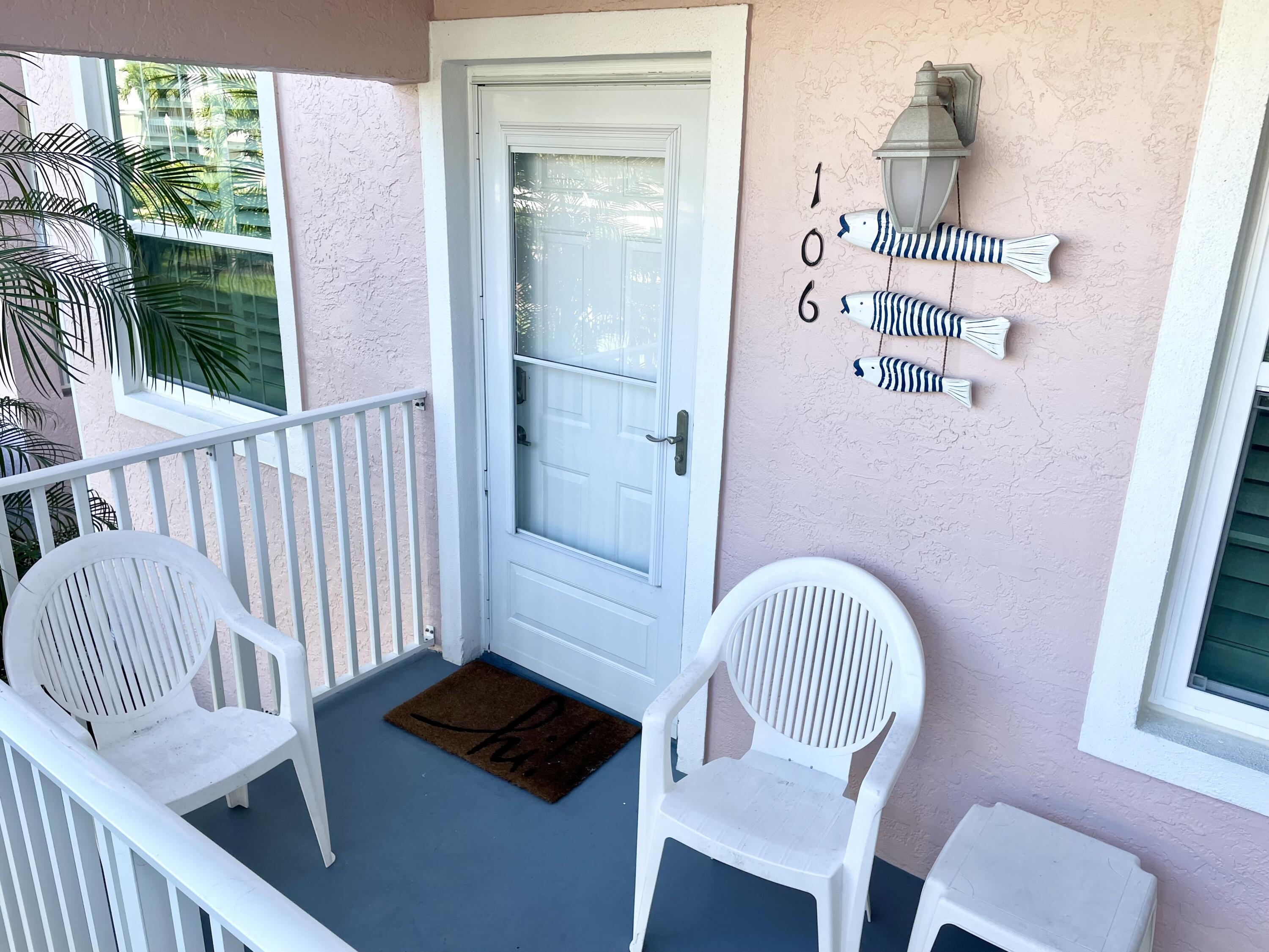 960 Huron Street, Unit 106 Marco Island, FL 34145 - Photo 3 of 39 a view of a hallway with seating area
