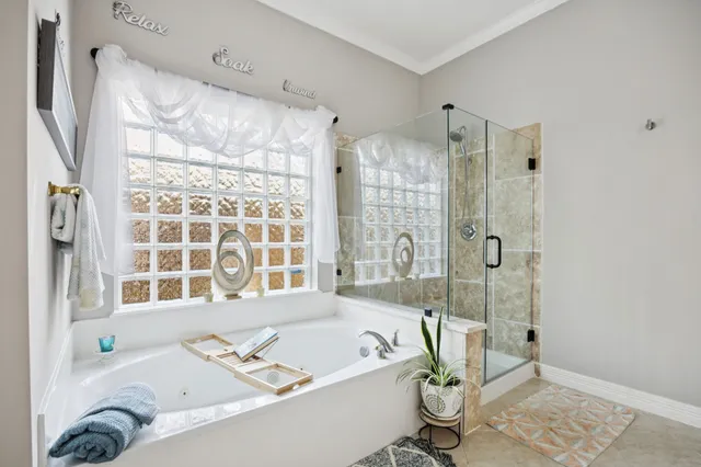 a bath tub sitting next to a window