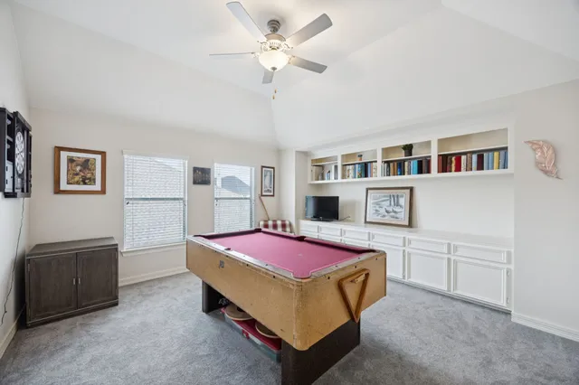 a bedroom with furniture and a chandelier