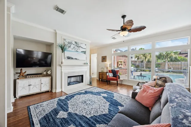 a living room with furniture flat screen tv and a fireplace
