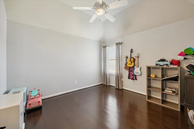 a view of a room with toys and wooden floor