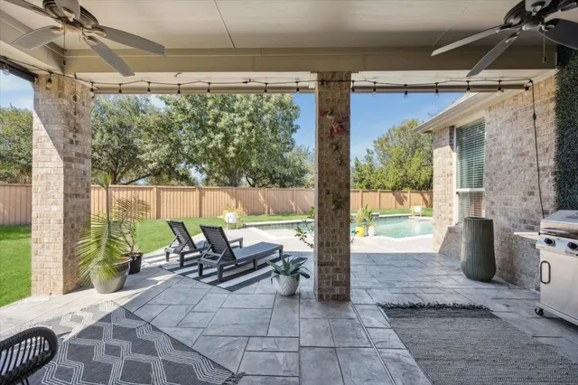 a view of swimming pool with outdoor seating