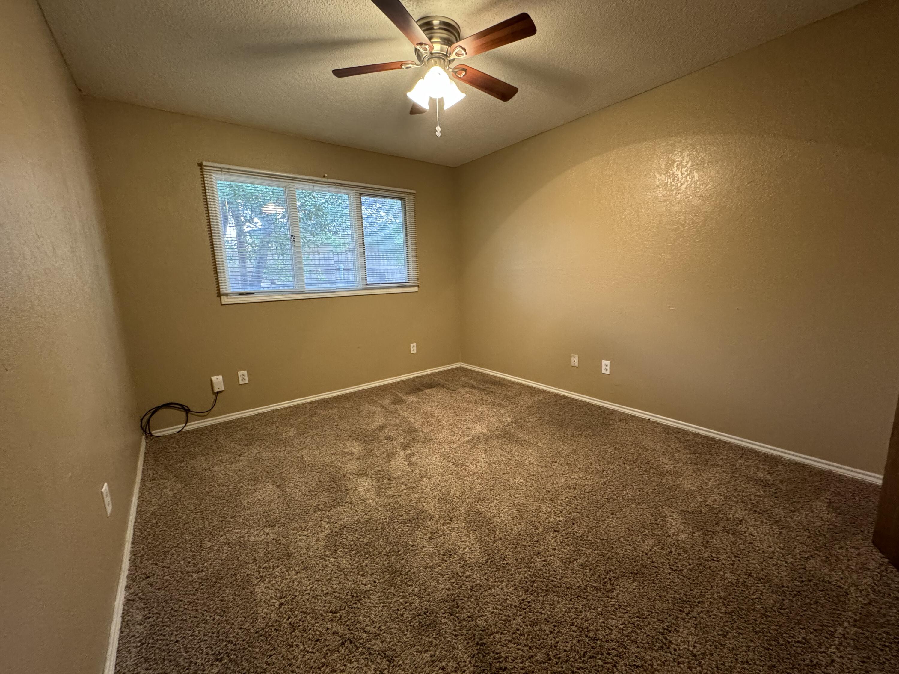 3103 75th Street, Unit B Lubbock, TX 79423 - Photo 17 of 22 a view of an empty room