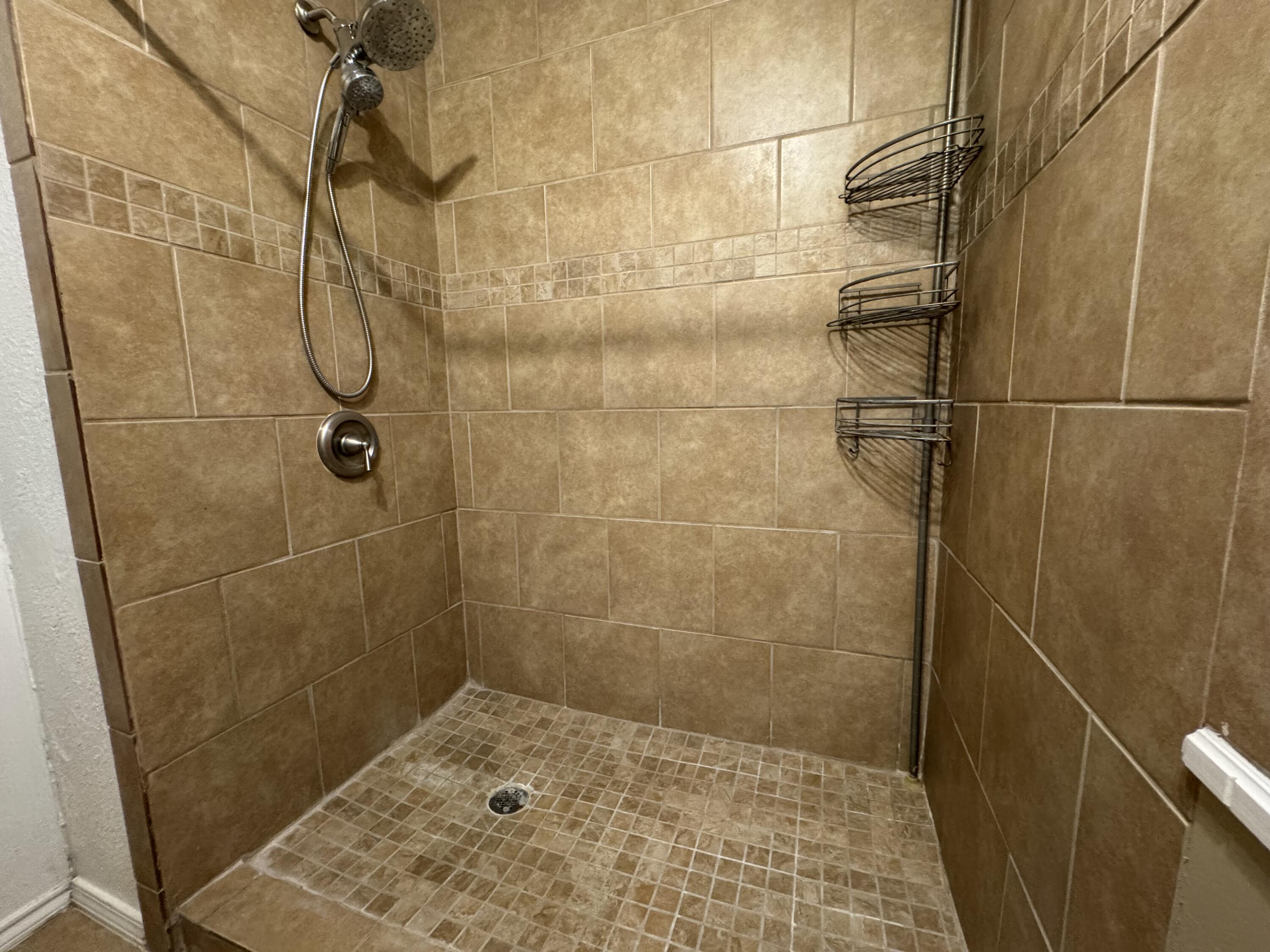 3103 75th Street, Unit B Lubbock, TX 79423 - Photo 21 of 22 a bathroom with a shower