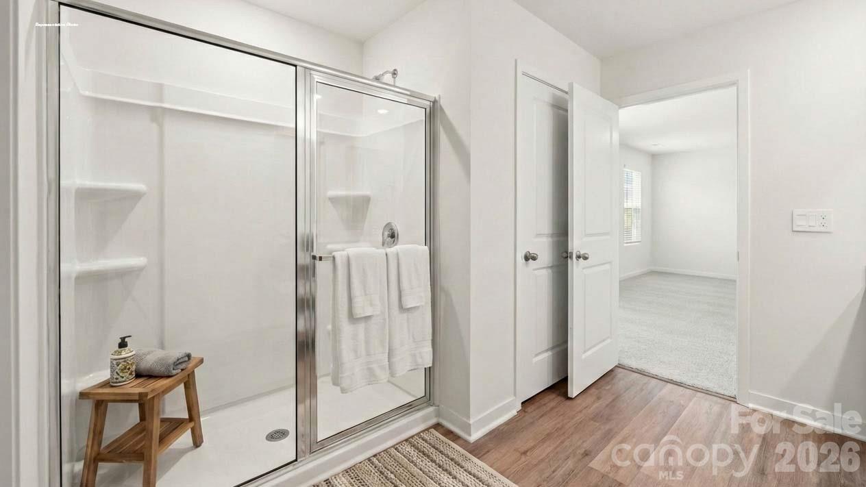 3913 Caroline Court Northwest Conover, NC 28613 - Photo 18 of 27 a bathroom with a glass shower door