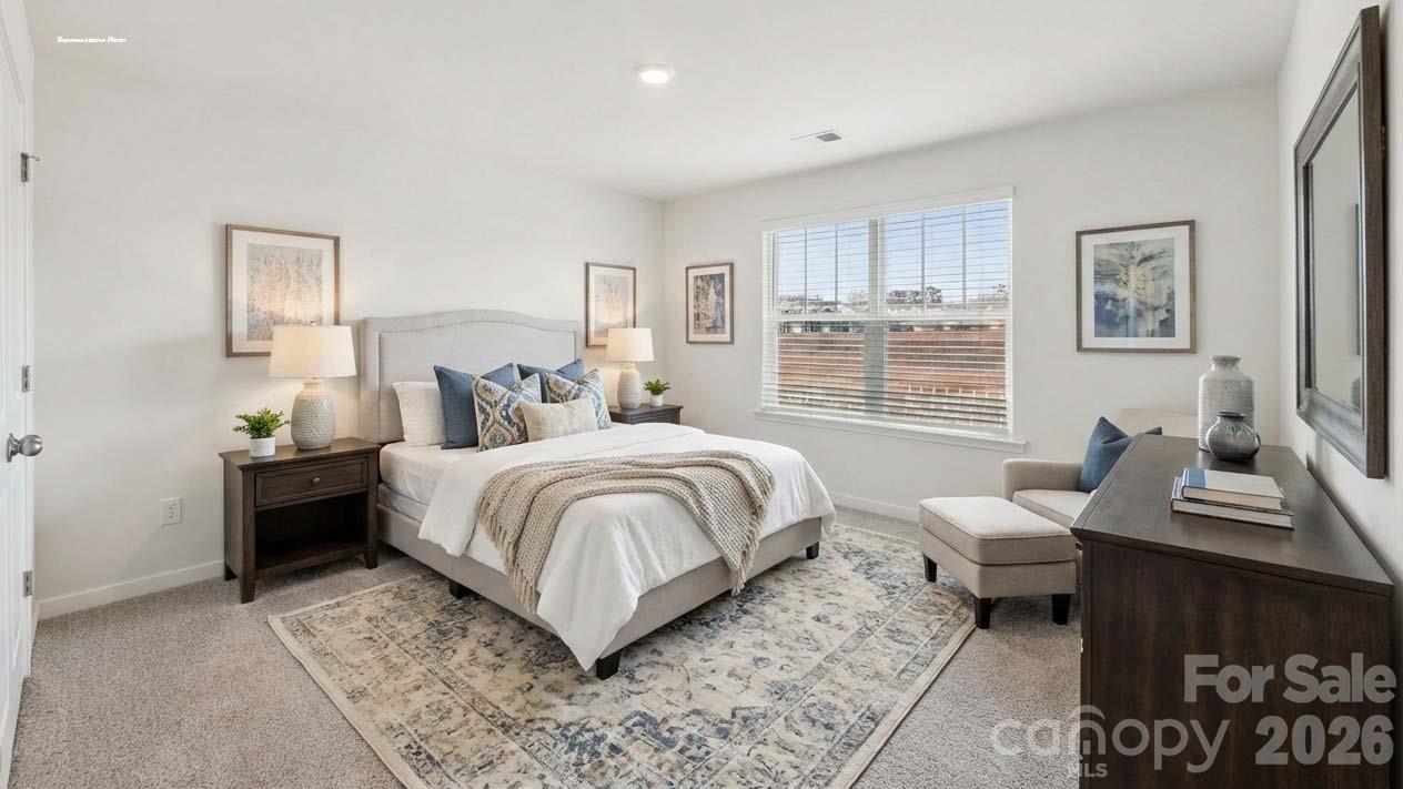 3913 Caroline Court Northwest Conover, NC 28613 - Photo 23 of 27 a bedroom with a bed and a window