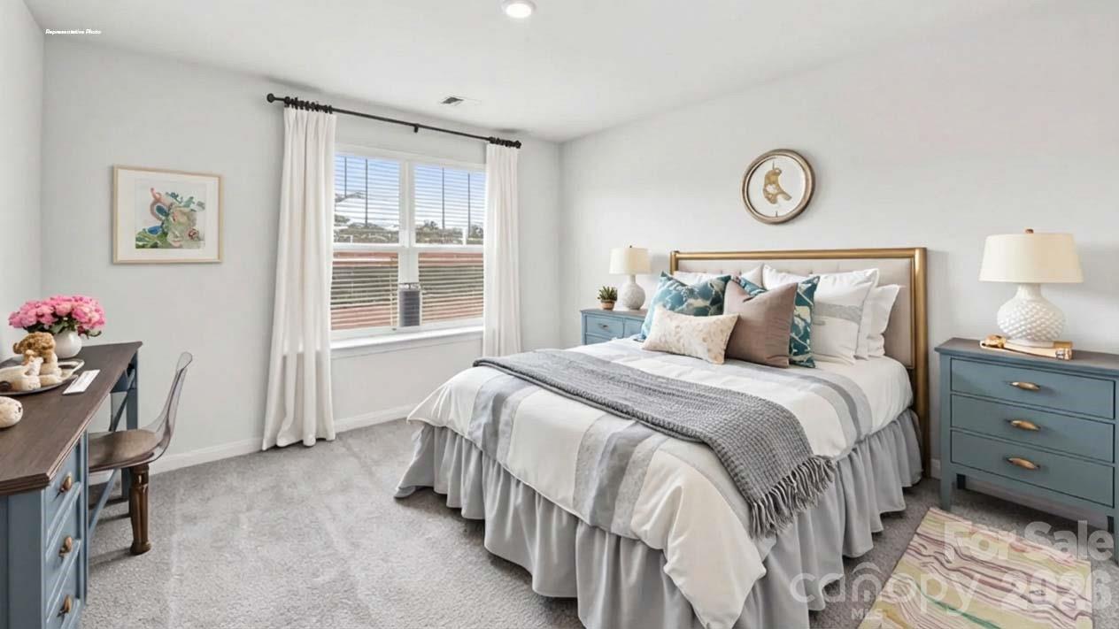3913 Caroline Court Northwest Conover, NC 28613 - Photo 26 of 27 a bedroom with a bed and a window