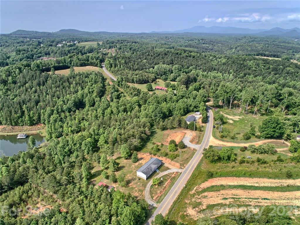 700 Will Green Road Tryon, NC 28782 - Photo 8 of 13 an aerial view of residential houses with outdoor space and trees