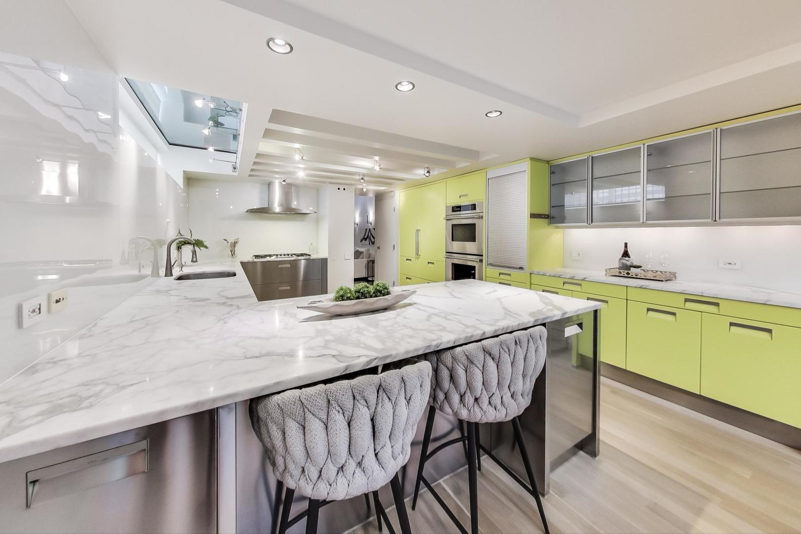 17 East Scott Street Chicago, IL 60610 - Photo 14 of 39 a kitchen with a table and chairs in it