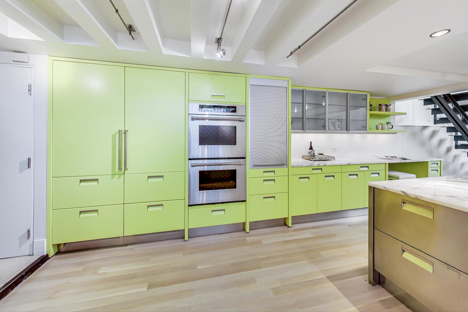17 East Scott Street Chicago, IL 60610 - Photo 16 of 39 a kitchen with a sink and cabinets