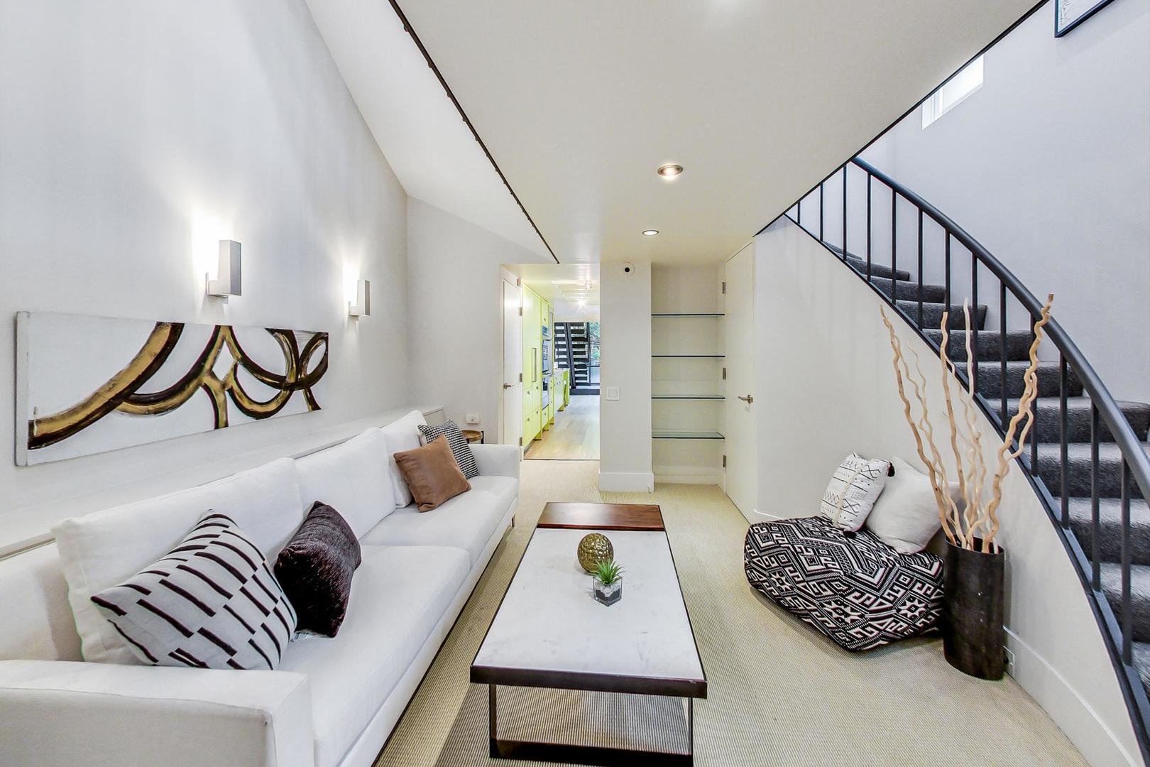 17 East Scott Street Chicago, IL 60610 - Photo 18 of 39 a living room with furniture and wooden floor