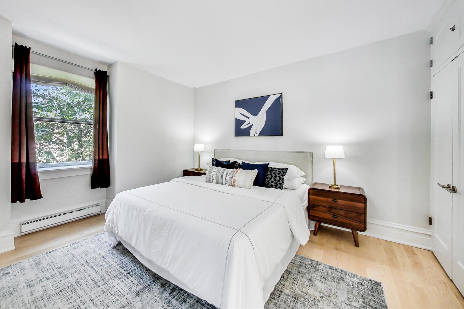 17 East Scott Street Chicago, IL 60610 - Photo 27 of 39 a bedroom with a bed and a window