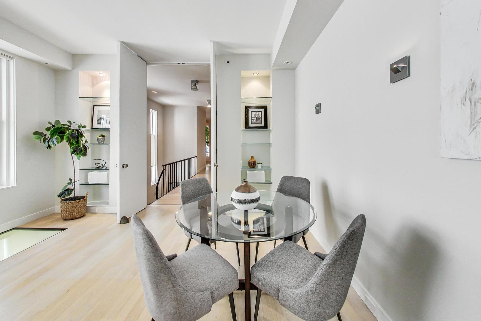 17 East Scott Street Chicago, IL 60610 - Photo 9 of 39 a view of a dining room with furniture and a potted plant