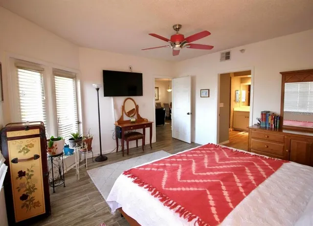 a bed room with a bed and a television