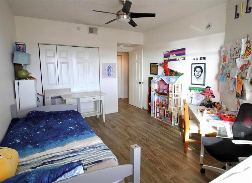6425 Shoreline Drive, Unit 10503 St. Petersburg, FL 33708 - Photo 7 of 11 a living room with furniture and a wooden floor