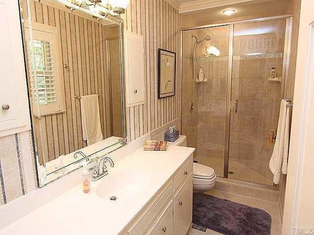 2108 Coley Forest Place Raleigh, NC 27607 - Photo 8 of 12 Master bath has been recently renovated. Large step in shower is plus.