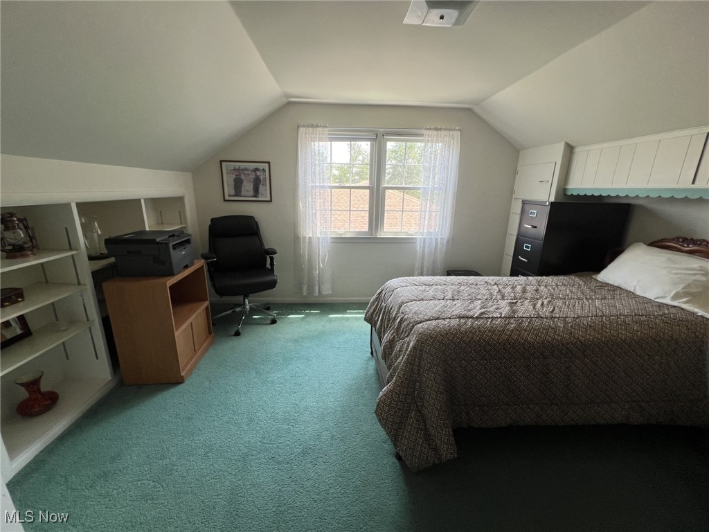 7579 McCreary Road Independence, OH 44131 - Photo 19 of 33 Carpeted bedroom with vaulted ceiling and baseboards