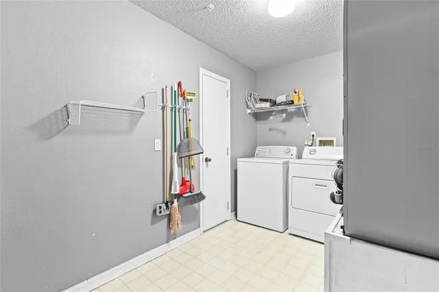 a view of storage and utility room with washer and dryer