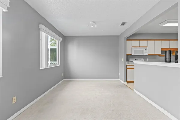 a view of a kitchen with a sink cabinets and a window