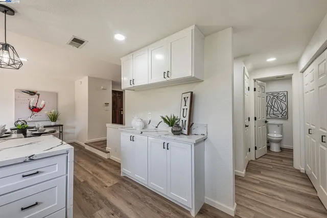 a kitchen with a stove microwave and refrigerator