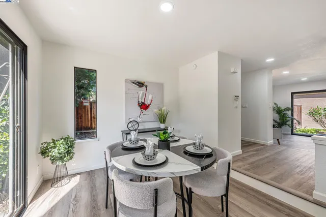 a kitchen with a table and chairs