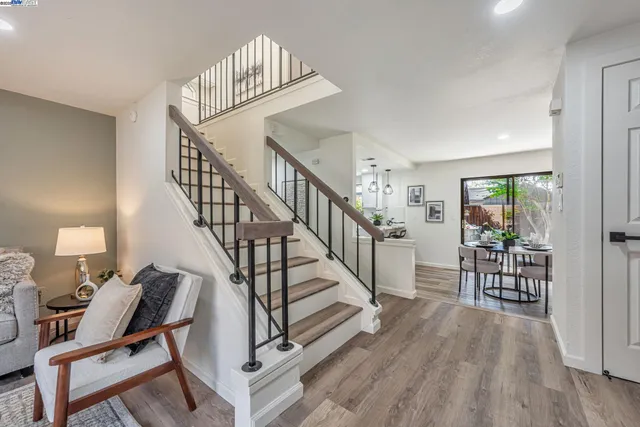 a view of entryway and hall with wooden floor