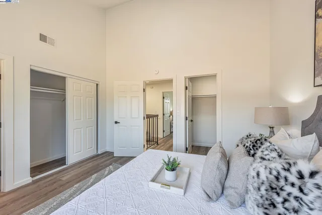 a bedroom with bed and a window