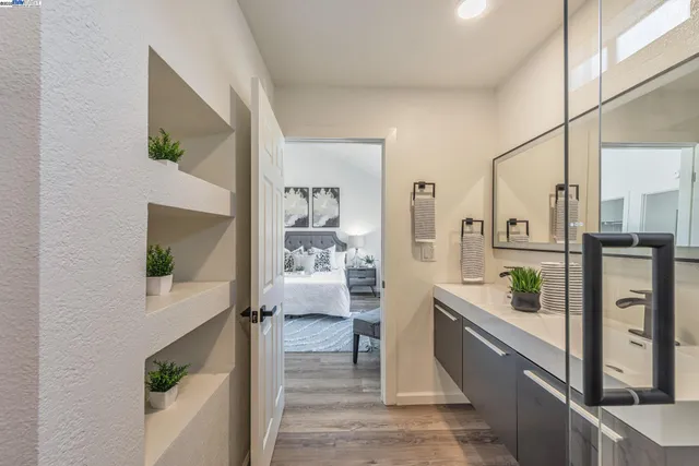 a bathroom with a double vanity sink and a bathtub